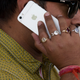 An Indian man talks on his iPhone in New Delhi in May 2016.